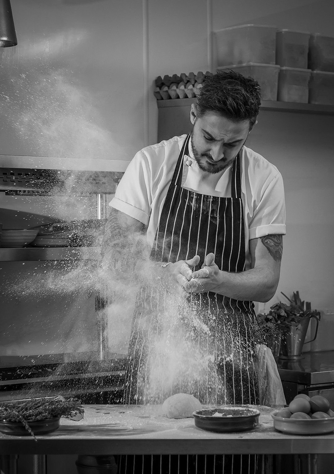 Chef preparing fresh dough in a restaurant kitchen